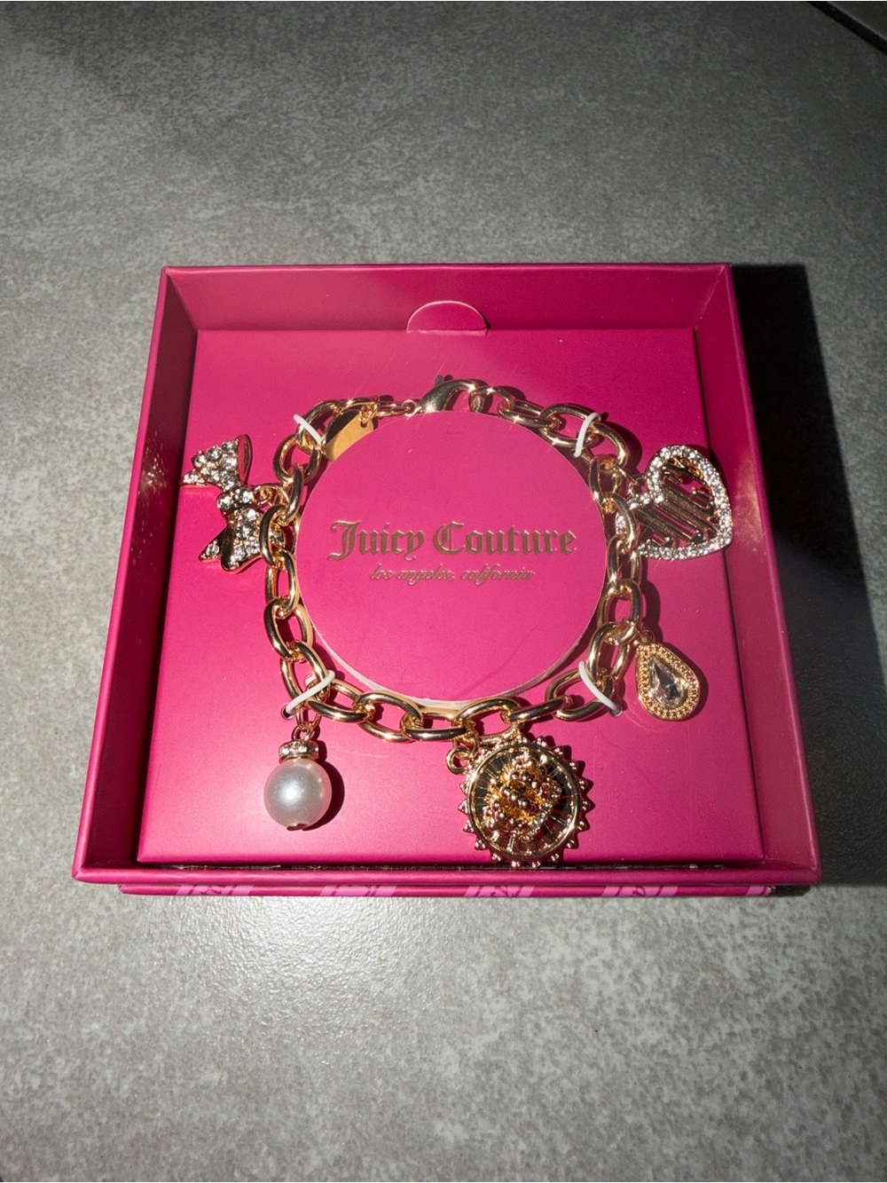 Juicy Couture Gold-Tone Charm Bracelet with Pink Box
